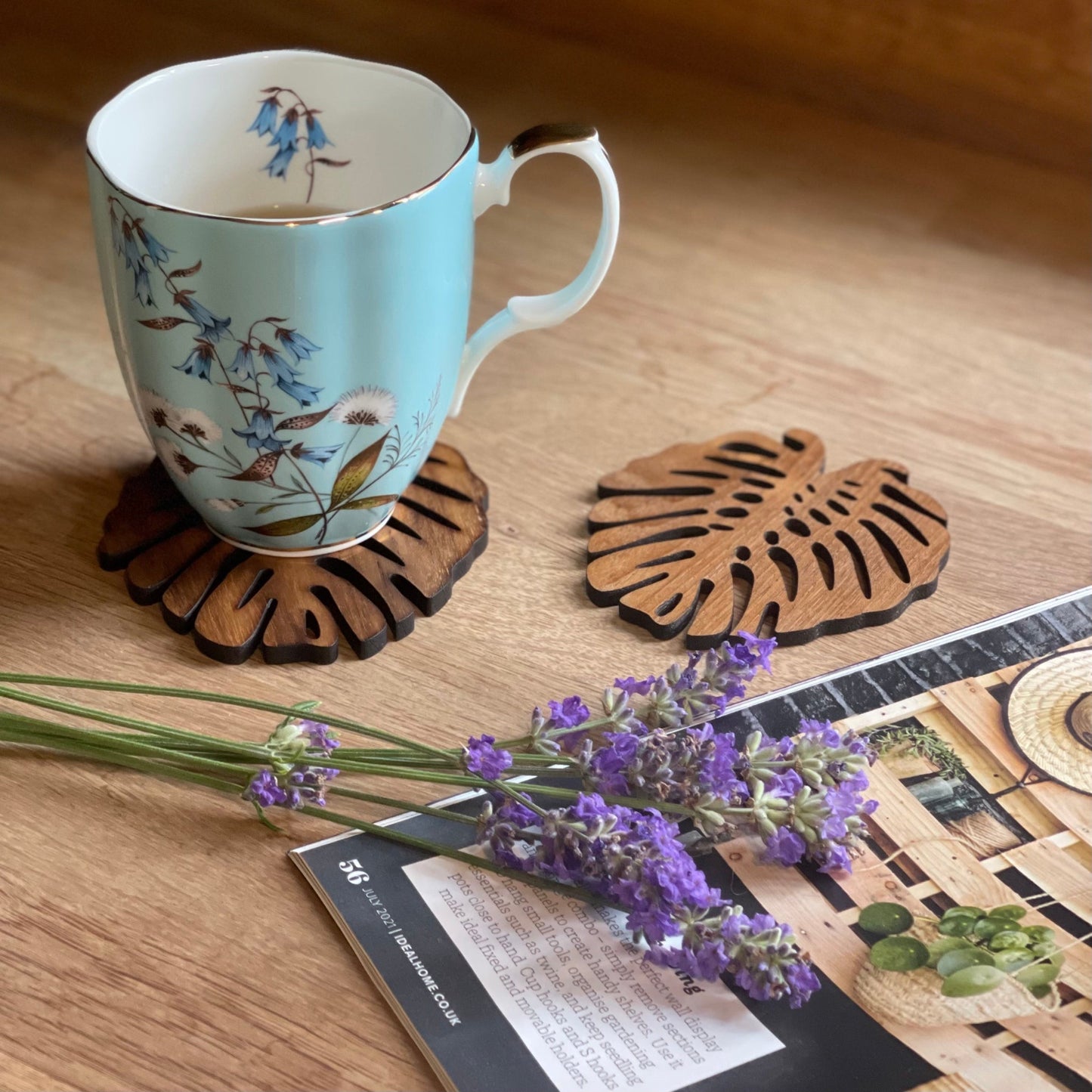 Monstera-shaped upcycled teak wood coasters, available as a set of 2 or 4.